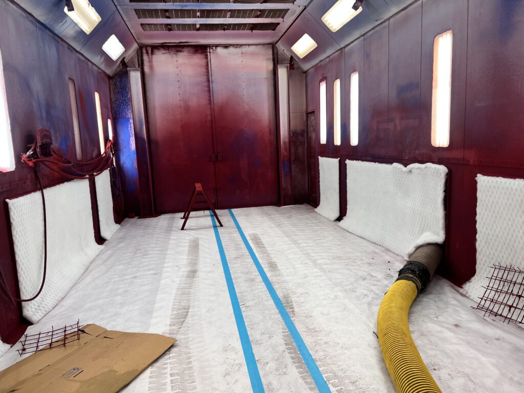 Interior of commercial vehicle with air duct cleaning equipment, hoses and protective materials
