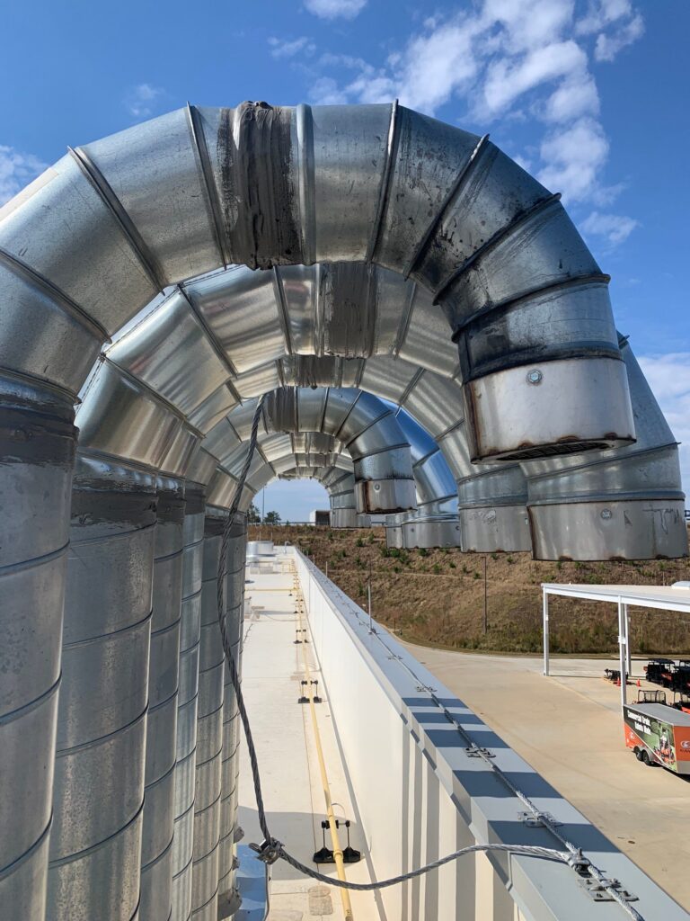 Massive industrial air duct system for commercial HVAC cleaning services, ensuring optimal air quality.